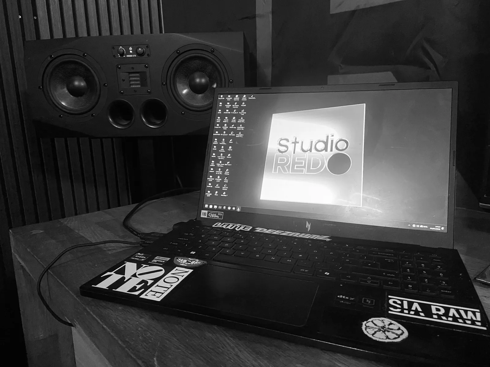 Studio RED production desk with laptop and studio monitors